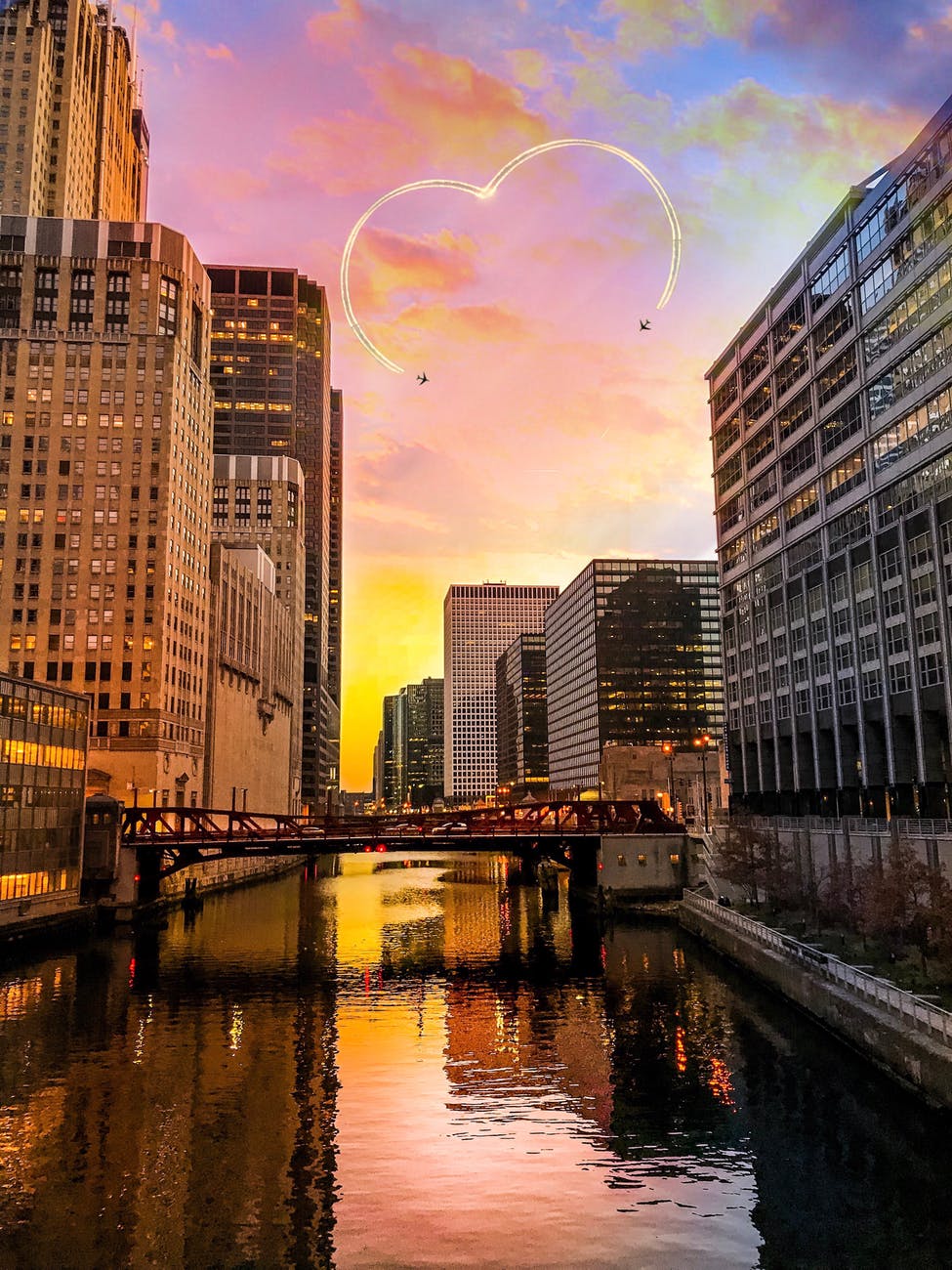 two black aircrafts above buildings golden hour