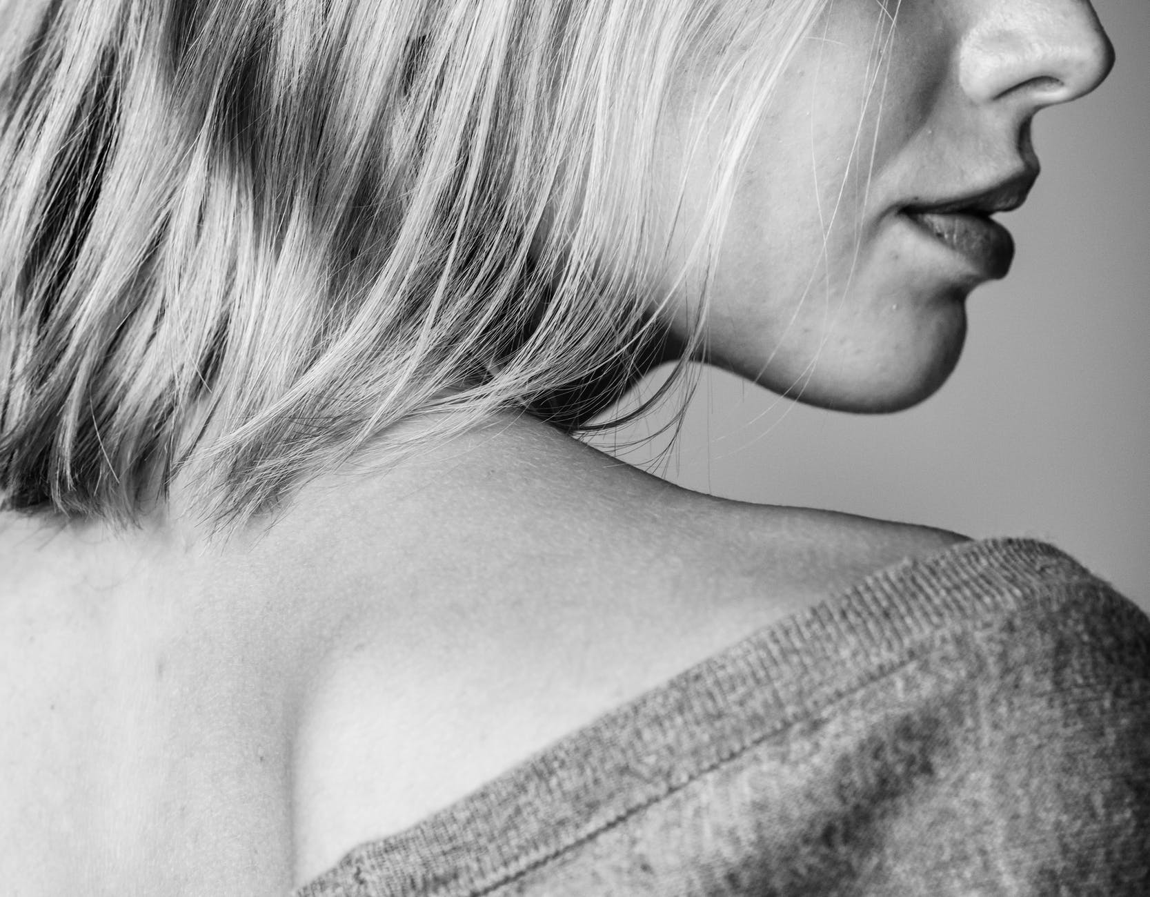 grayscale photo of woman wearing shirt